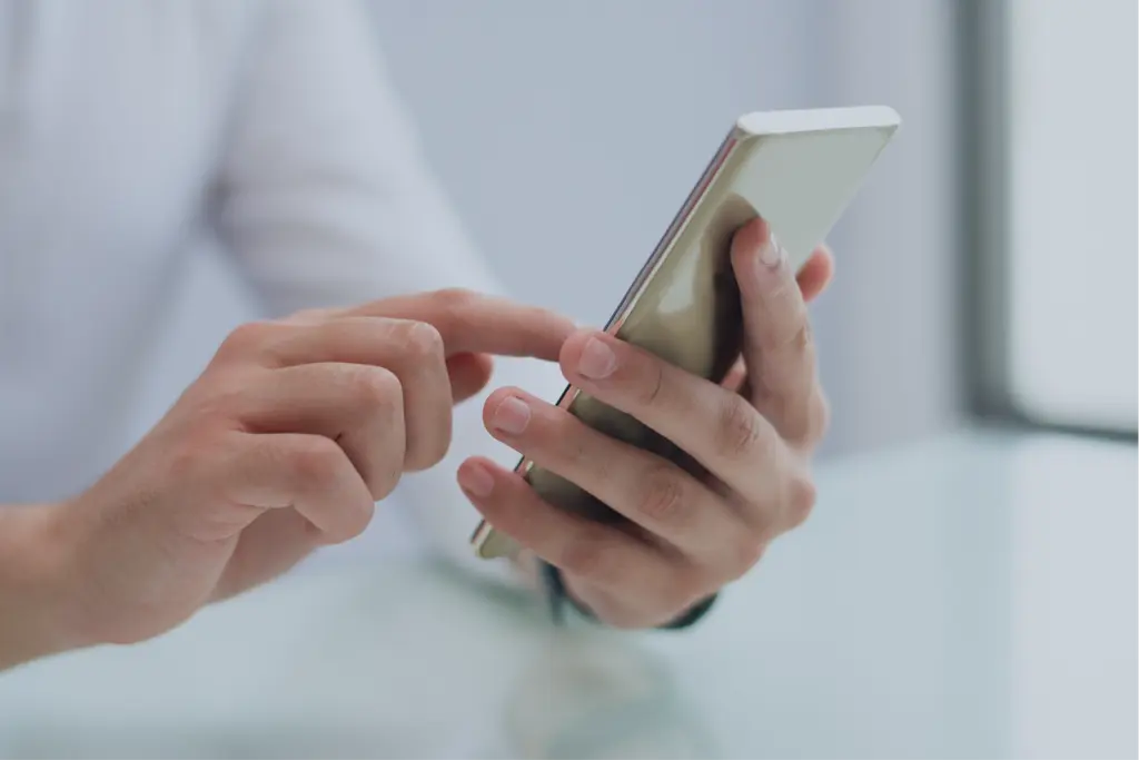 close-up-of-male-hands-using-smartphone-12